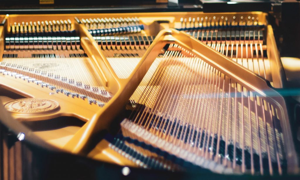close up photo of the inside of a grand piano